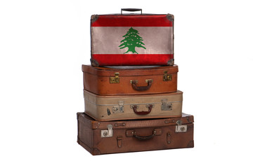 Lebanon, Lebanese travel concept. Group of vintage suitcases isolated on white background.