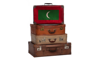 Maldives, Maldivian travel concept. Group of vintage suitcases isolated on white background.