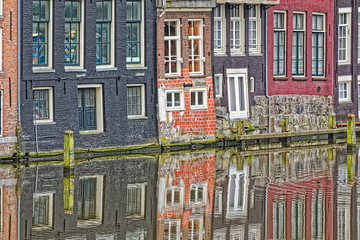 Amsterdam old houses reflection in river Amstel