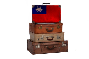 Taiwan, Taiwanese travel concept. Group of vintage suitcases isolated on white background.