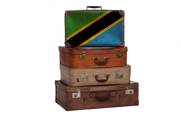 Tanzania, Tanzanian travel concept. Group of vintage suitcases isolated on white background.