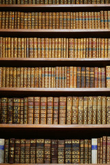 old books on wooden shelf