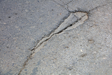 Broken asphalt pavement