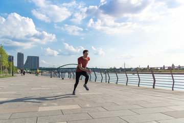 Sport athletic guy doing a stamina exercise, sprinting very fast