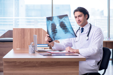 Young male doctor radiologist working in the clinic