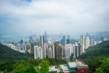Fototapeta na wymiar A cloudy day at the Victoria Peak in Hong Kong , this stunning viewpoint will blow your mind with its iconic skyscrapers and the harbor below. 