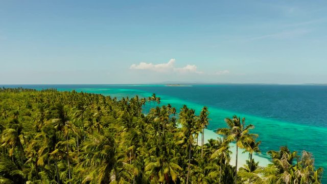 Sandy beach and tropical island by atoll with coral reef, top view. Patongong Island with sandy beach. Summer and travel vacation concept.