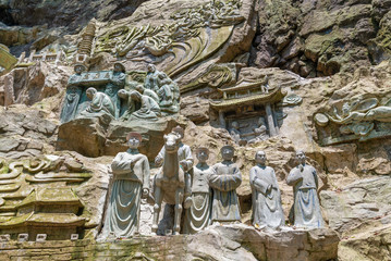 Cliff stone carvings on the half-mountain side of Emei Mountain, Sichuan Province, China