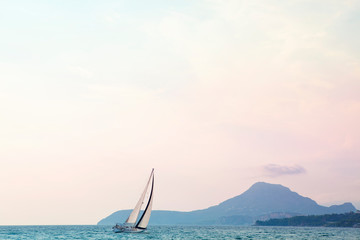 Obraz premium yacht in the bay in the sunny day 