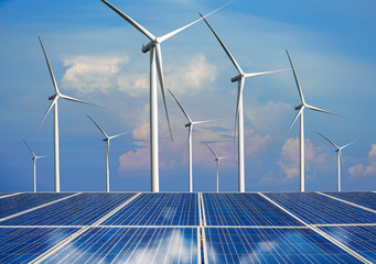 Solar energy panel photovoltaic cell and wind turbine farm power generator in nature landscape for...
