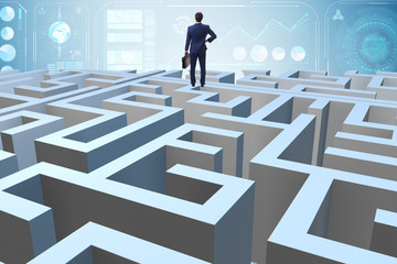 Businessman trying to escape from maze