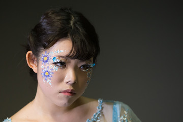 Chiba, Japan, 02/18/2019 , Japanese young model with facepaint during a photo shoot.