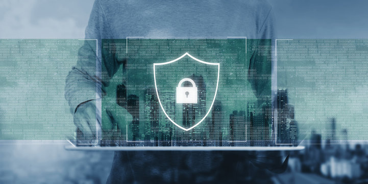 Online data security system and AI. artificial intelligence technology. a man using digital tablet with lock shielding lock icon