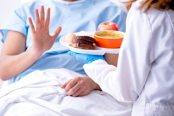 Male patient eating food in the hospital