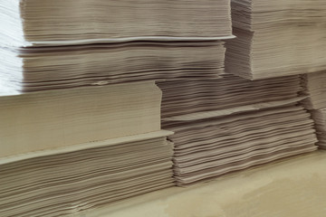 Sheets of white paper piled up for printing.