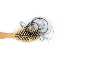 Hairs fall with comb or hairbrush isolated on white background,concept medical hair transplants or serious hair loss problem