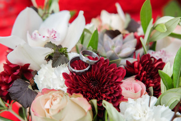 Wedding bouquet of bright flowers lying on the grass.