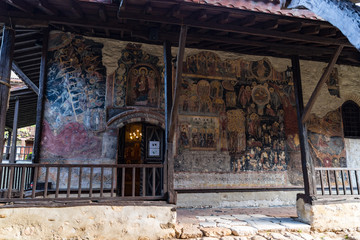 Fototapeta na wymiar Fresco on church wall in courtyard of The Medieval Orthodox Monastery of Rozhen, near Melnik, Bulgaria
