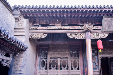 Ancient Chinese Architectural Gateway Wall under Clear Sky and White Cloud, Pingyao County,...