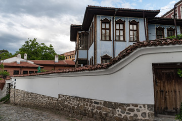  View of a narrow street in  historical part of  Plovdiv Old Town. Typical medieval colorful buildings. Bulgaria