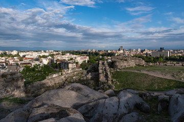 Fototapeta na wymiar Part of ancient fortress wall on top of the Nebet tepe Hill in Plovdiv city,.Bulgaria. Panoramic view .
