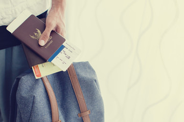 Closeup of Man holding passports and boarding pass,Business travel concept