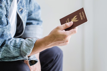 Closeup of Man holding passports and boarding pass,Business travel concept