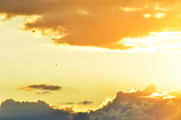 sky with clouds contrasting colors orange with dark
