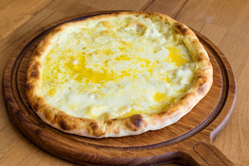 Traditional Turkish Pide at Kebab Restaurant on Wooden Table.