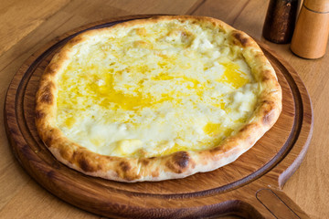 Traditional Turkish Pide at Kebab Restaurant on Wooden Table.