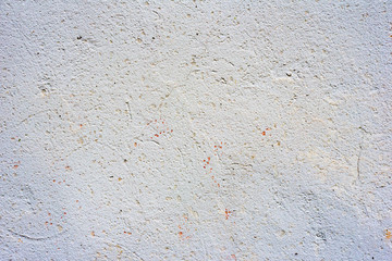 Texture of a concrete wall with cracks and scratches which can be used as a background