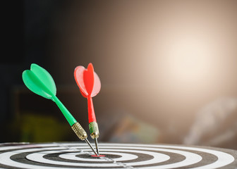 Fototapeta premium Dart arrow hitting in the target center of dartboard,business target