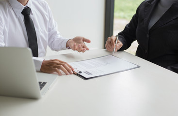 Executives are interviewing job applicants and preliminary background checks, candidates are talking about their past work experience, personal managers make hiring decisions.