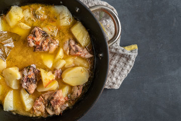 pan with cooked potato fried meat balls with herbs and spices