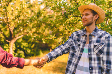 farmers shake hands, sign contract, agriculture concept