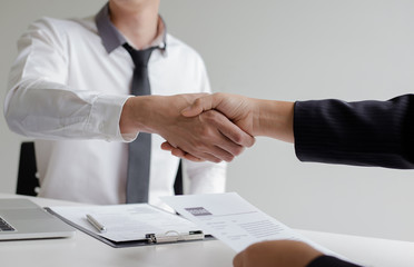 Business success, Human Resources Manager welcomes new employees to work in the company, successful handshaking.