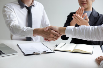 Business success, Human Resources Manager welcomes new employees to work in the company, successful handshaking.