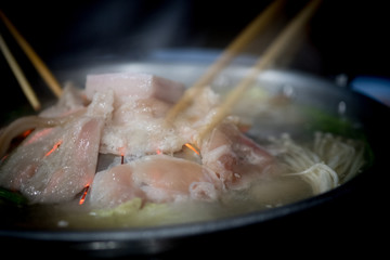 Pork or meat put on hot pan on the stove