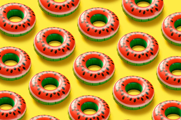 Seamless pattern with Inflatable watermelons on a pink background.