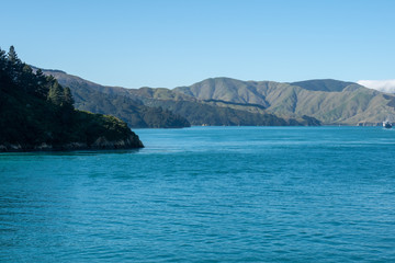 Fototapeta na wymiar Beautifil rugged costal scenery sailing across the ocean in New Zealand