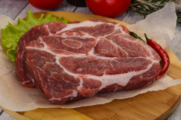 Raw pork neck steak