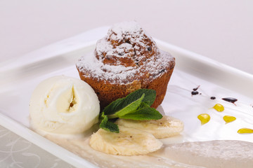 Tasty hot muffin with ice cream