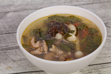 Thai style soup with meat and mushrooms