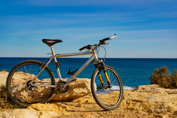 Bicycle on beach, active lifestyle.