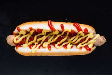 hot dog on the black background