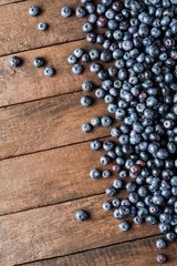 Blueberries on wooden background with copyspace