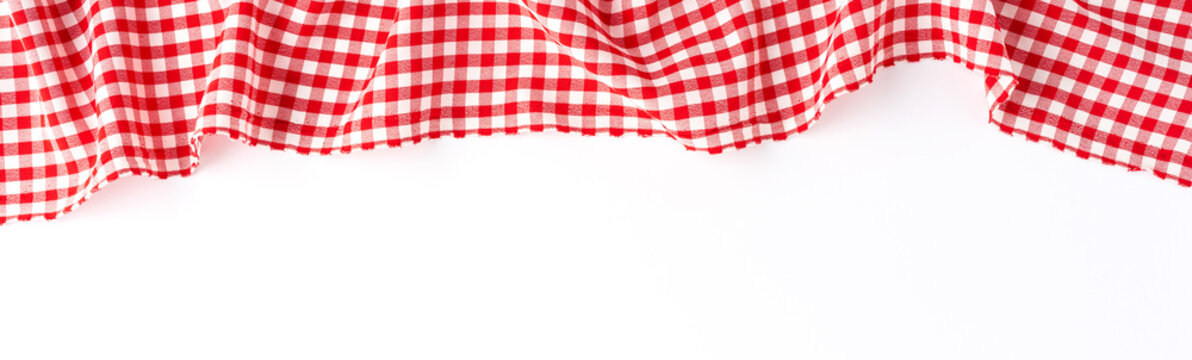 Red checkered tablecloth isolated on white background. Banner
