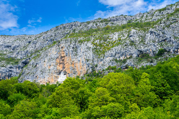 Montenegro, Ostrog monastery building hidden in rock wall cliff, visited by hundreds of thousands...