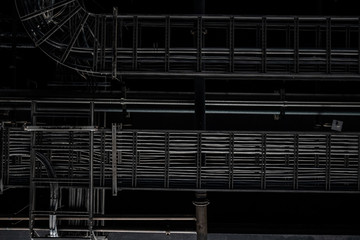 Industrial exposed ceiling with timber boards, steel beams and exposed wiring. Textured background graphic asset.