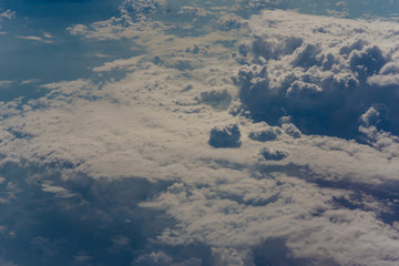 Fototapeta premium Blue sky with cloud above view from airplane